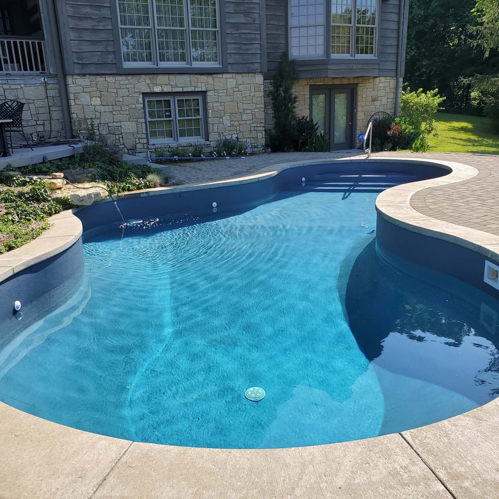 Finished pool and backyard by Madison Pool and Spa
